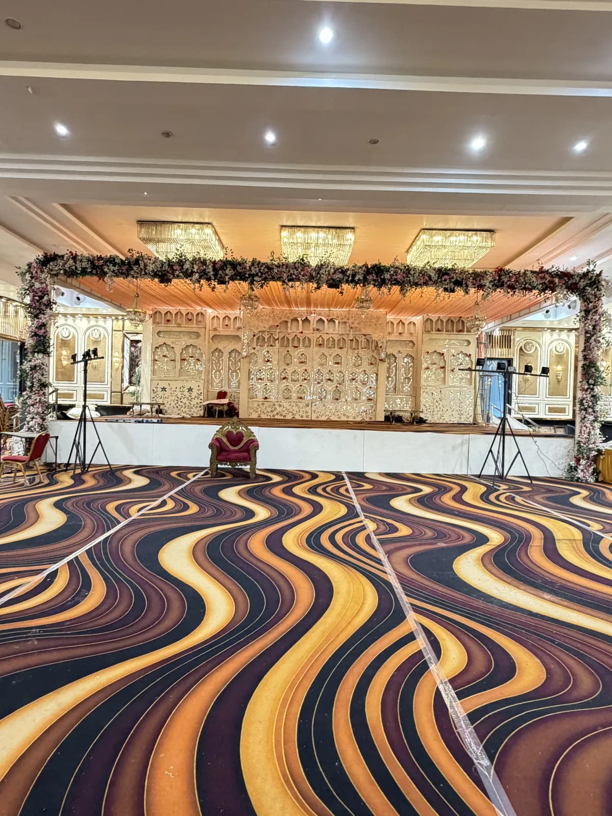 Decorated banquet hall stage at SNJ Laxmi Dham, Vrindavan